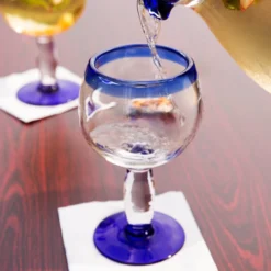 Libbey 92309 Aruba 16 Oz. Customizable Round Cocktail Glass With Cobalt Blue Rim And Base - 12/Case